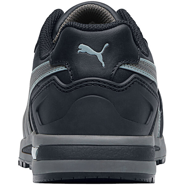 A black Puma women's athletic shoe with a grey sole.