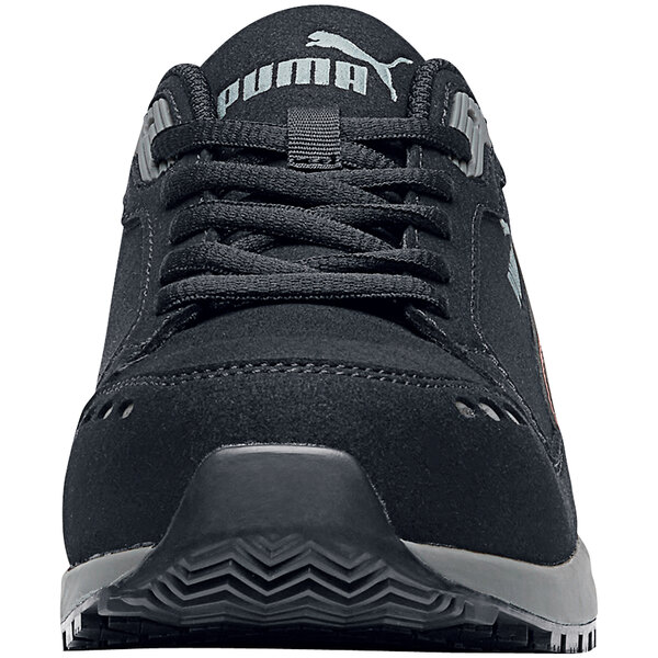 A black Puma Airtwist Low athletic shoe with a grey sole on a table.