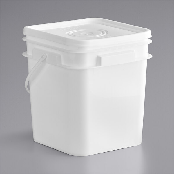 A white plastic tub of Cookie Dough Bliss Edible Biscoff Cookie Dough with a lid and a handle.