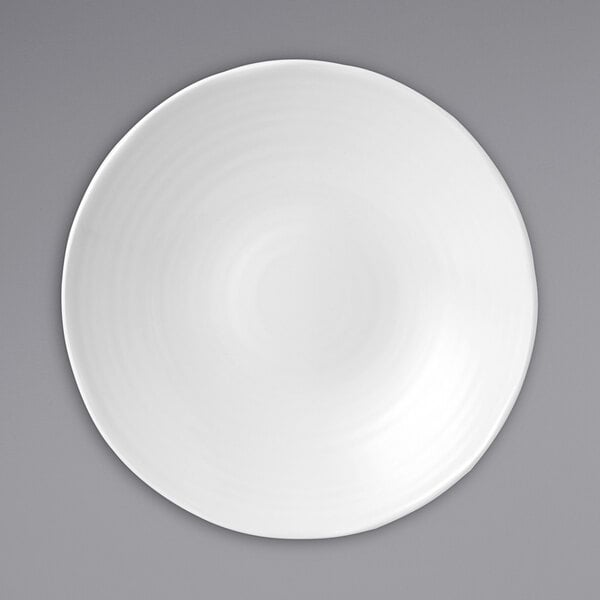 A white Dudson Organic china bowl with a white rim.