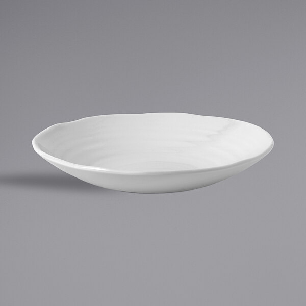 A Dudson Organic White china bowl on a white surface.