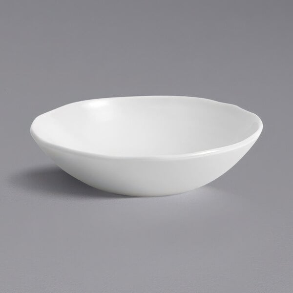 A Dudson Organic White china bowl on a gray surface.