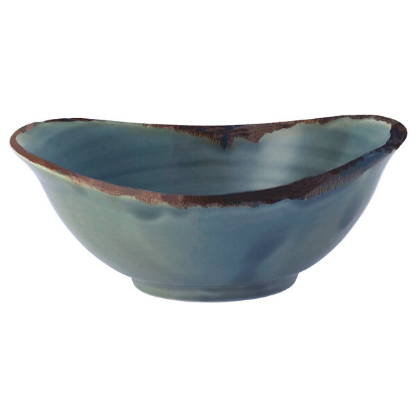 A close-up of a Dudson blue china bowl with brown edges.