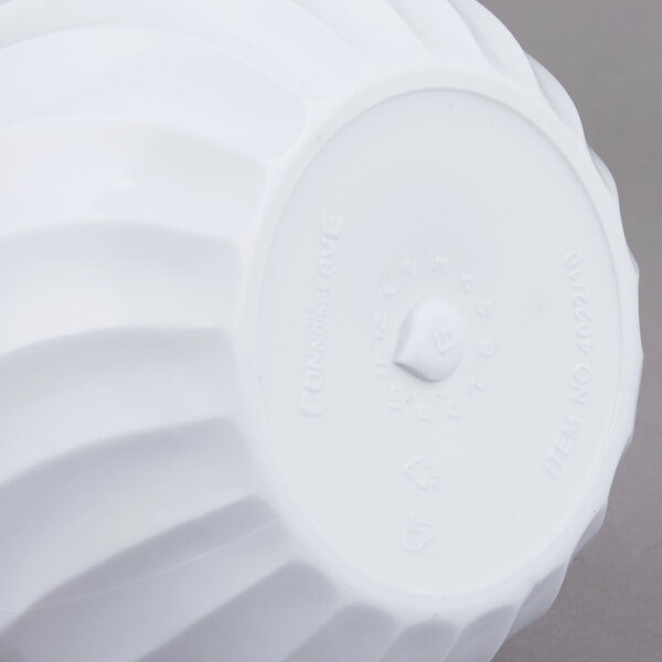 A white plastic Vollrath beverage server with a white lid.