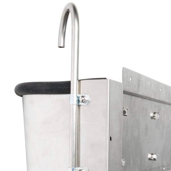 A stainless steel Nemco ice cream dipper well container with a hook.