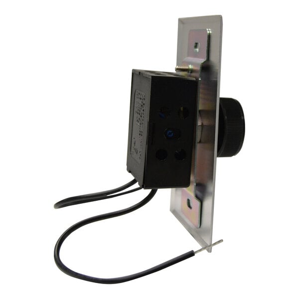 A wall-mounted electrical control device with a black knob, metal faceplate, and two exposed black wires.