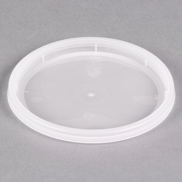 A Pactiv translucent plastic lid on a white surface.