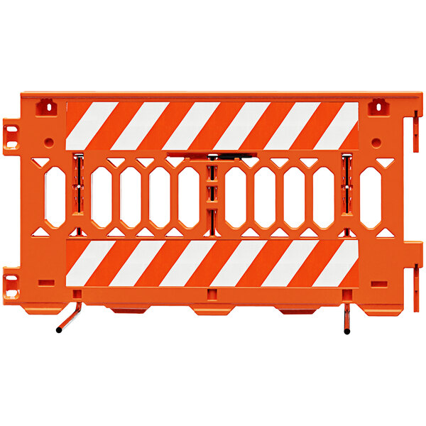 An orange Plasticade Pathcade barricade with white engineer grade striped sheeting on one side.