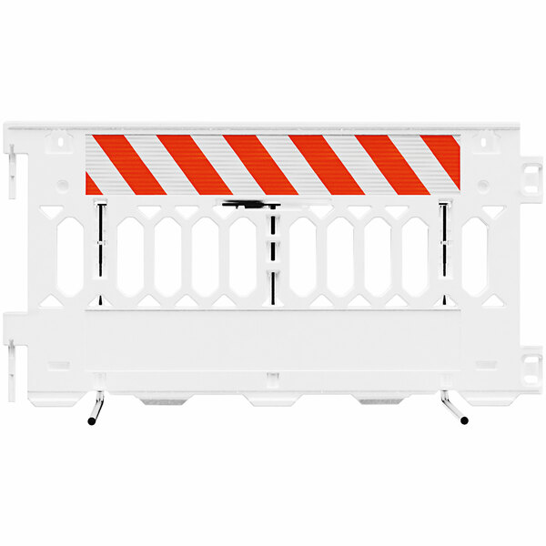 A white Plasticade parade barricade with white and orange striped sheeting on both sides.