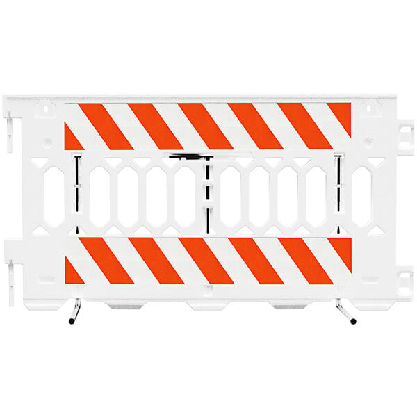 A white Plasticade parade barricade with white stripes and orange accents.