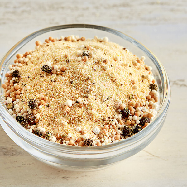 A bowl of Ball Bread and Butter Pickles on a table.