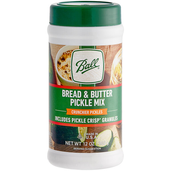 A white container of Ball Bread and Butter Pickle Mix with a green lid.