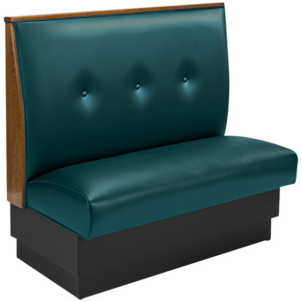 A forest green booth with button tufting on the back and end caps.