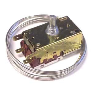 A small metal thermostat with a wire attached.