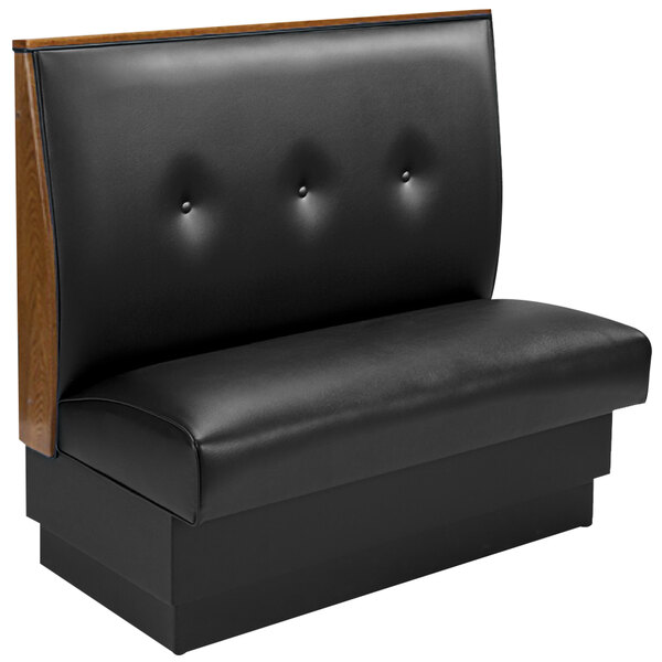 An American Tables & Seating black upholstered standard booth with wood end caps.