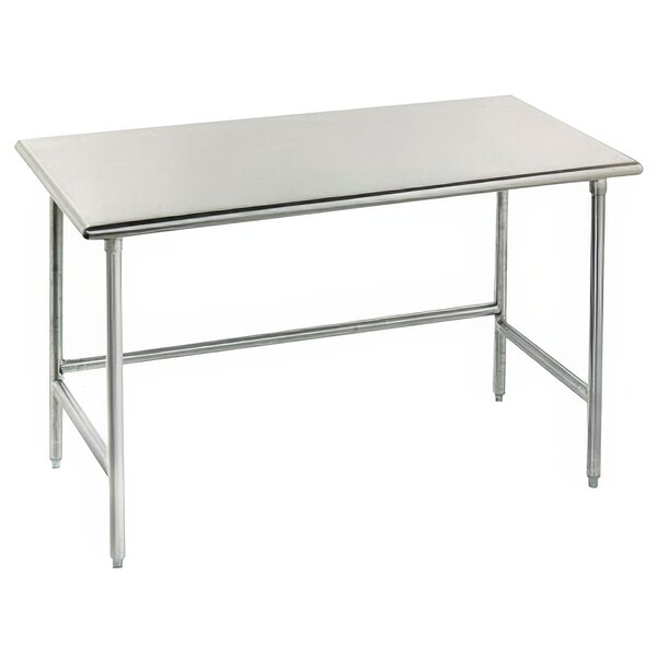 An Advance Tabco stainless steel work table with metal legs.