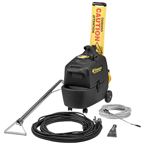 A black Tornado Pro Spotter Deluxe spot extractor with yellow text and a hose.