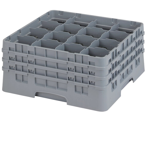 A grey plastic container with 16 compartments and extenders with holes.