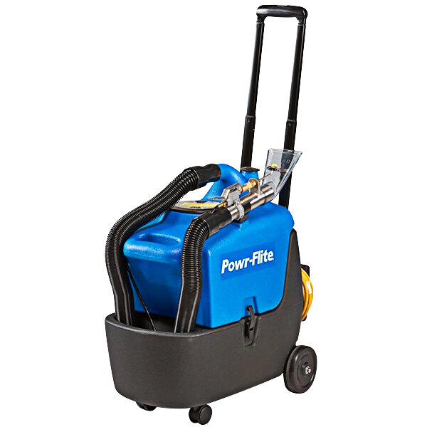 A close-up of a blue and black Powr-Flite portable carpet spotter.