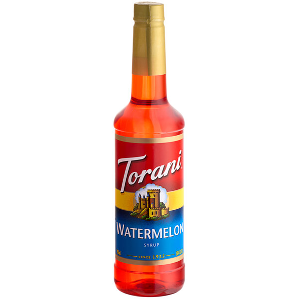 A Torani Watermelon Flavoring Syrup bottle on a table.