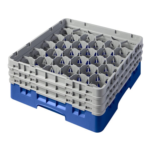 A blue and grey plastic Cambro glass rack with extenders.