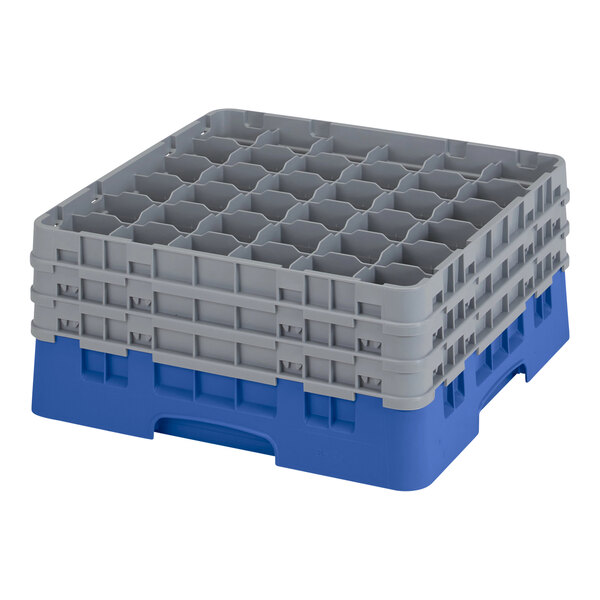 A stack of blue Cambro plastic glass racks with grey handles.