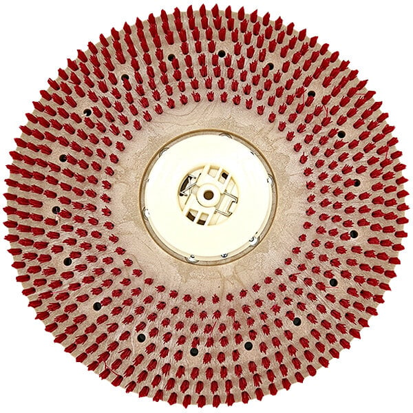 A white circular tufted pad driver with red bristles and holes in it.