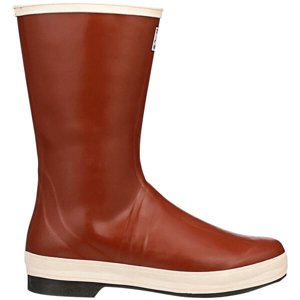 A close up of a Tingley brick red and brown rubber boot with a white sole.