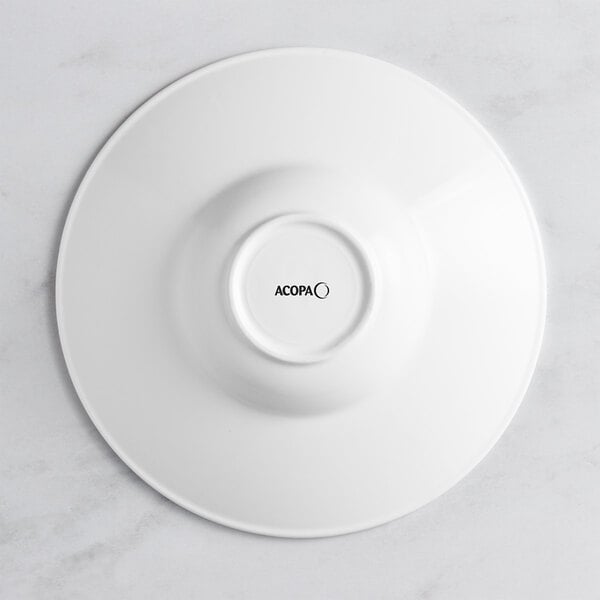 A white Acopa porcelain bowl with an embossed circle on the rim.