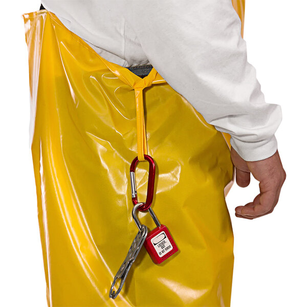 A person wearing Tingley Iron Eagle yellow coveralls with patch pockets.