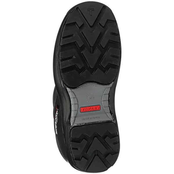 A close up of the black Tingley Flite Safety boot with a cleated outsole and red logo.