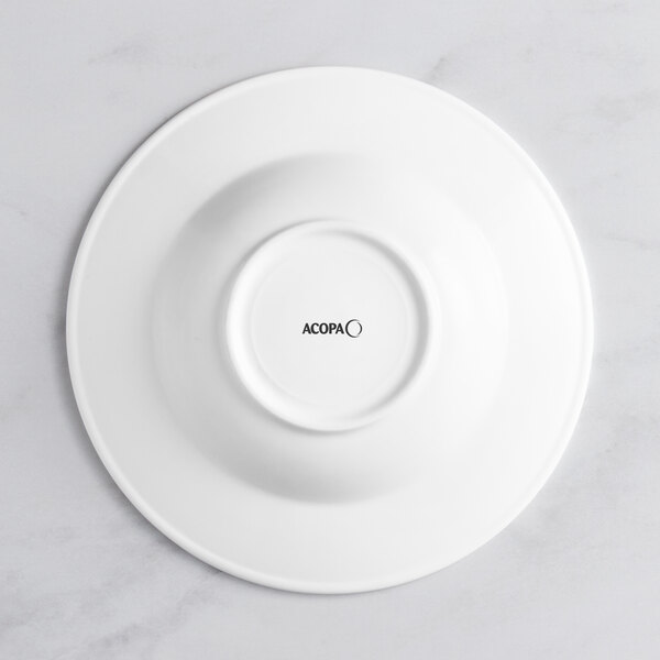 An Acopa Cordelia bright white porcelain bowl with an embossed circle on the rim.