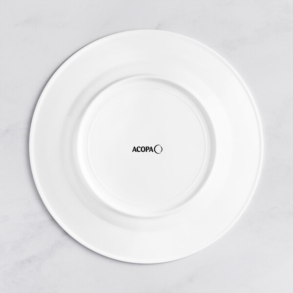 An Acopa Cordelia white porcelain plate with black text on the rim.
