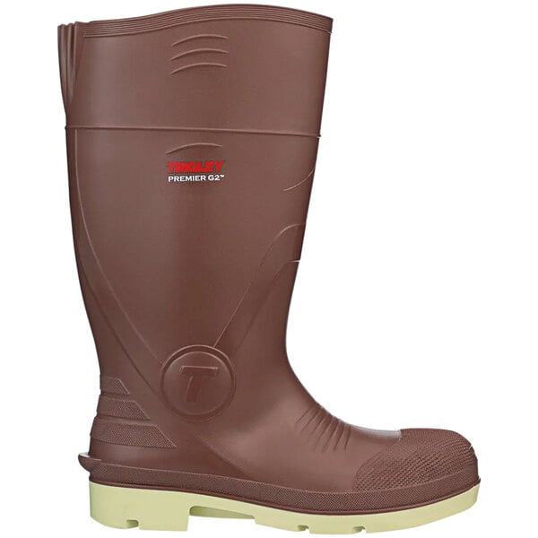 A brown Tingley Premier waterproof knee boot with white non-slip toe.