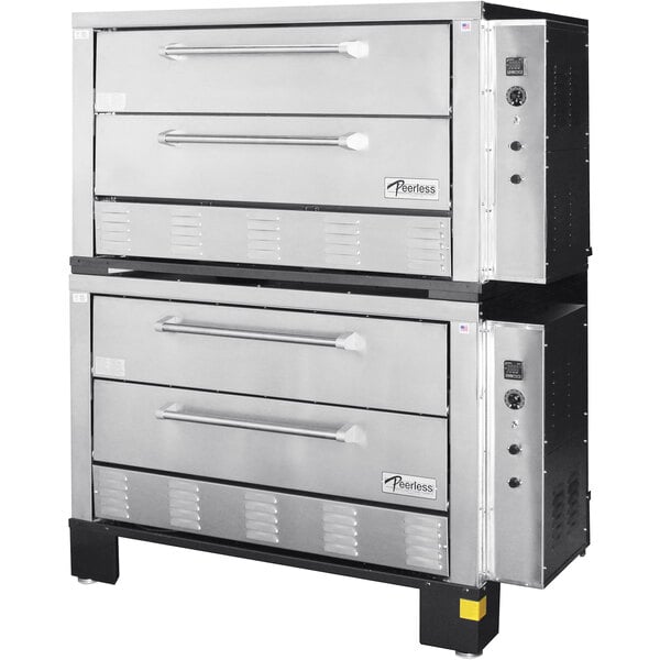 A Peerless stainless steel electric quadruple deck pizza oven with side controls.
