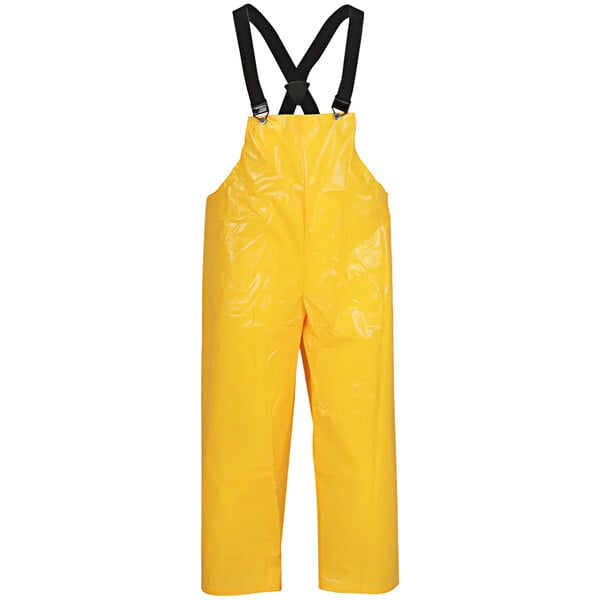 A yellow Tingley Iron Eagle rain overall with black straps.