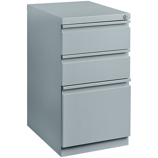 A platinum file cabinet with three drawers.