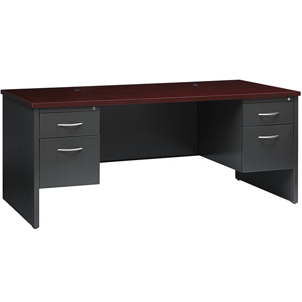 A charcoal and mahogany desk with two pedestals.
