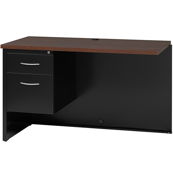 A black desk with a wooden top and a left-hand return with a walnut finish.