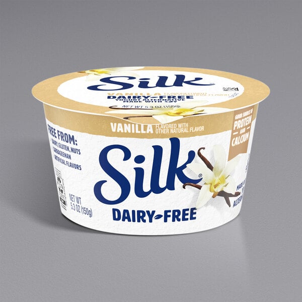 A container of Silk Dairy-Free Vanilla Soymilk Yogurt Alternative with brown and blue text on a white surface.