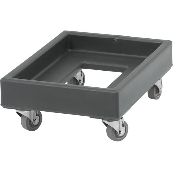 A black plastic Cambro milk crate dolly with wheels.