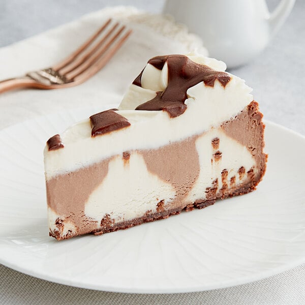 A slice of Eli's Brown Cow Cheesecake on a plate with a fork.