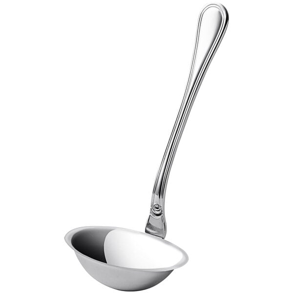 A silver ladle with a long handle.