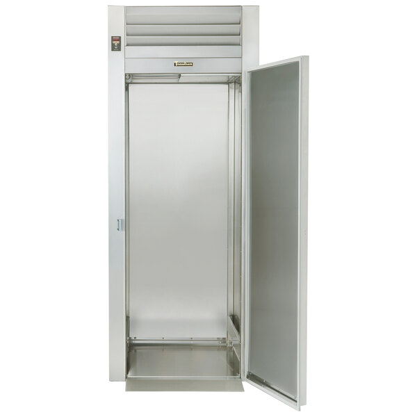 A Traulsen stainless steel roll-in refrigerator with the door open.