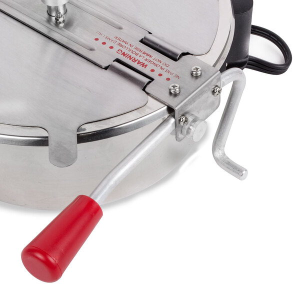 A close up of a Galaxy stainless steel kettle with a red handle.