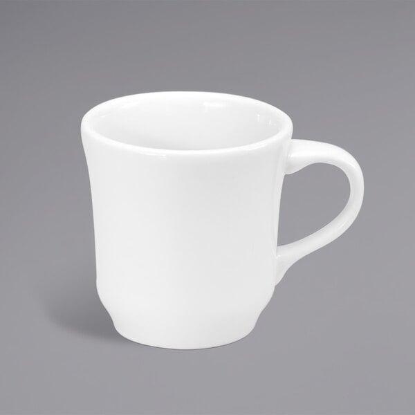 A white porcelain cup with a handle.