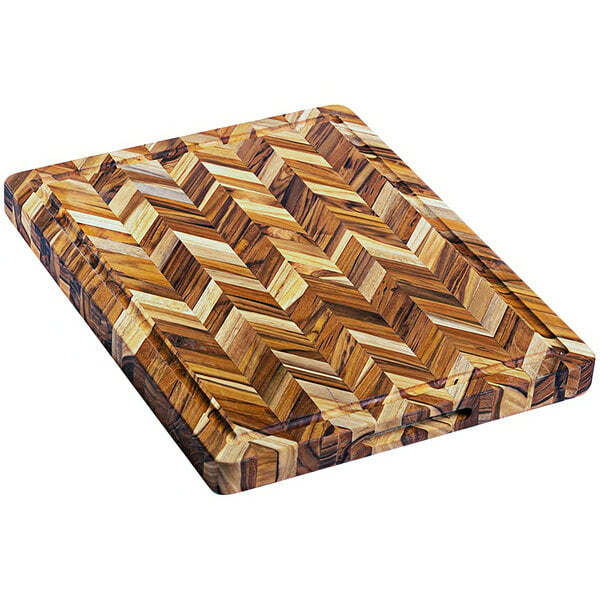 A Teakhaus wooden cutting board with a herringbone pattern.