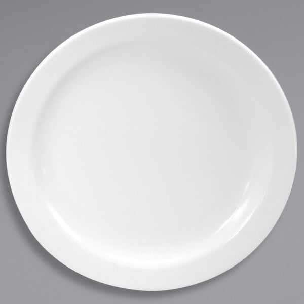 A white plate with a round rim.