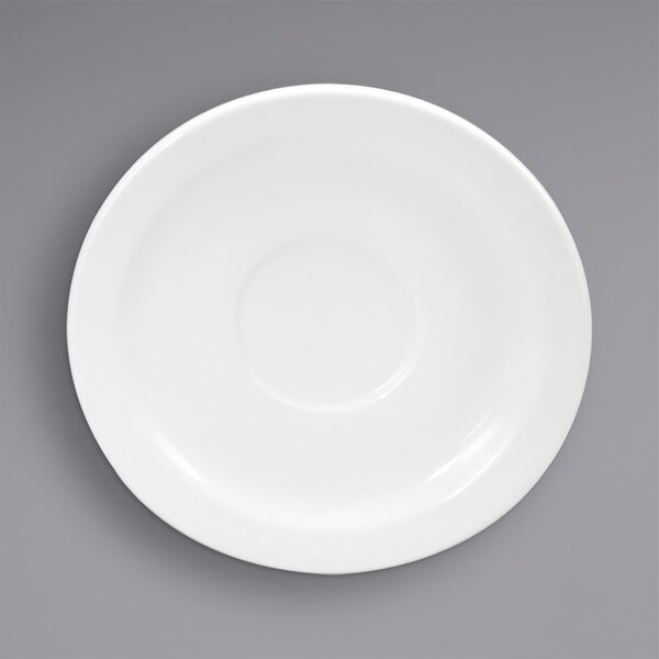 A white porcelain saucer with a circle.