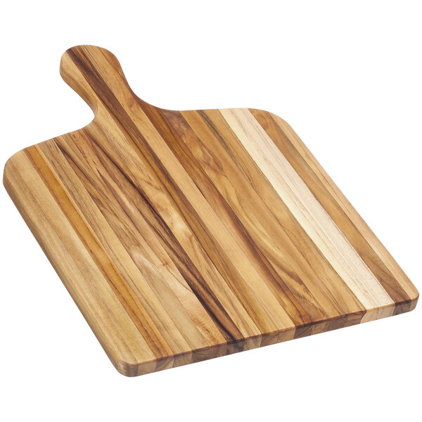 A Teakhaus teakwood serving board with a handle.